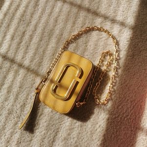 yellow/tan chain crossbody bag